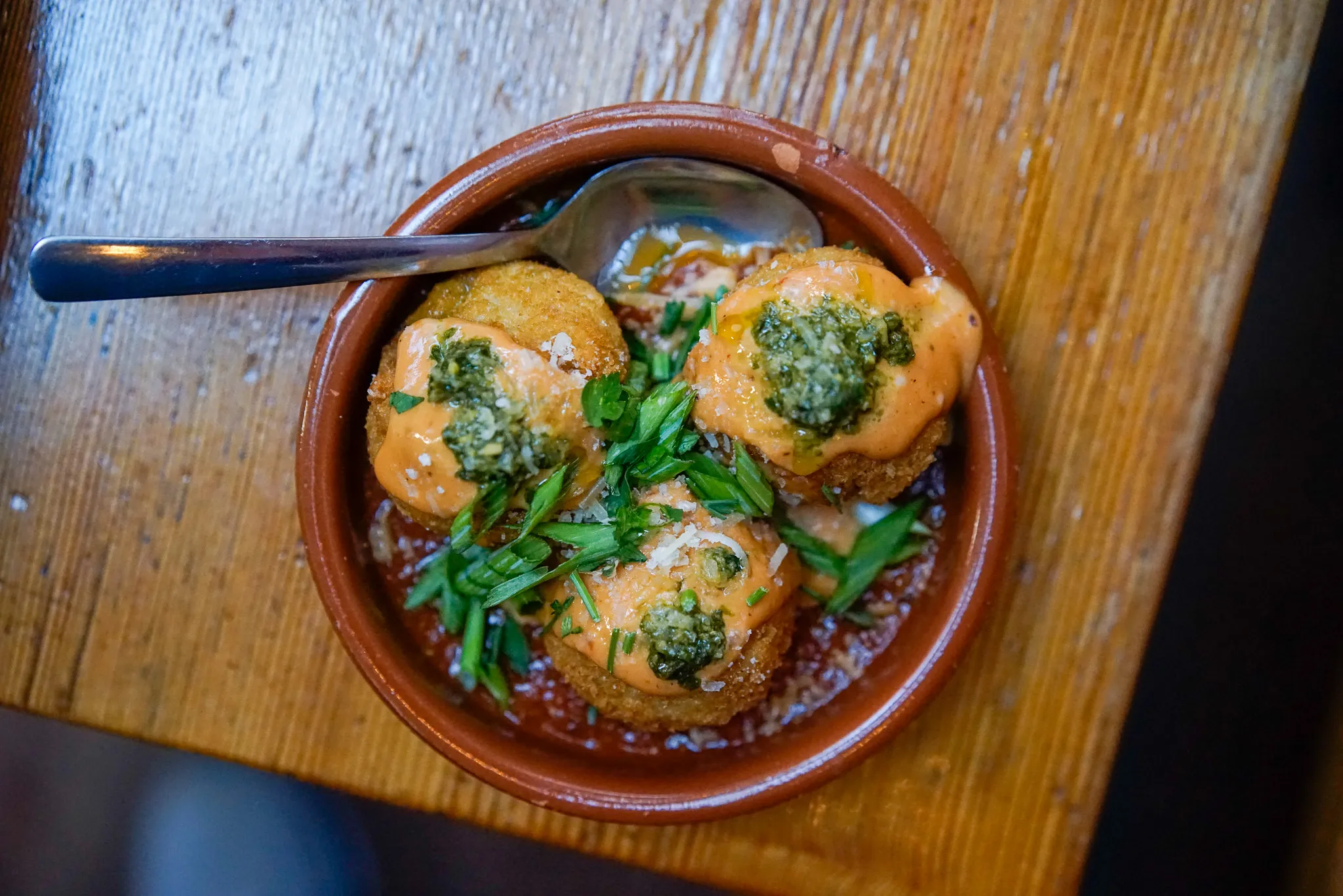 Spanish jamón-béchamel croquetas, golden and crisp, at Perro Negro Taperia
